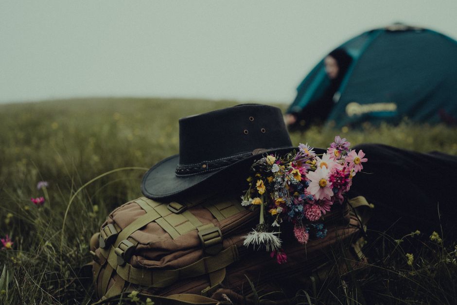 Nature A Tranquil Camping Site In Chechnya With A Backpack, Cowboy Hat, And Fresh Flowers In The Mist. HD Wallpaper #3834